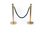 Golden poles & black rope